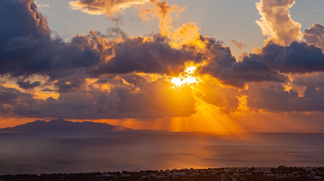Santorini which includes a sunset, general coastal views and landscape views