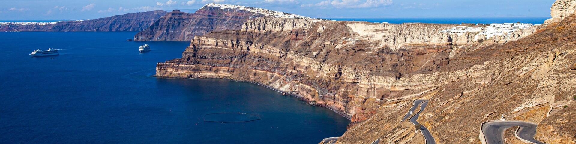 Santorini featuring rugged coastline and general coastal views