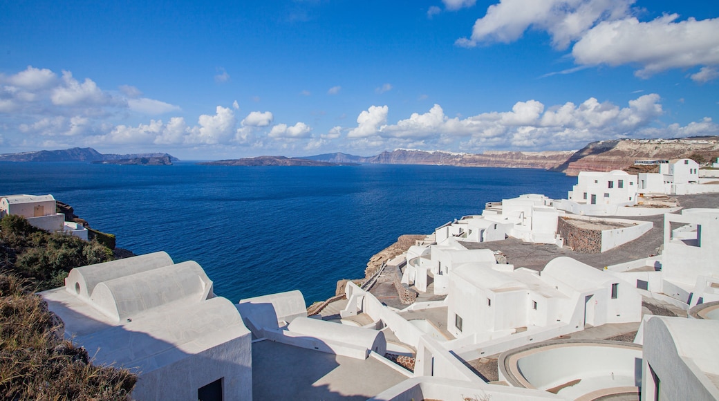 Santorini which includes general coastal views and a coastal town