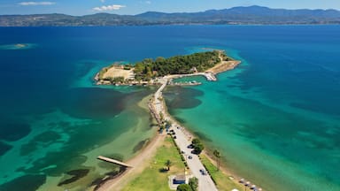 Aerial drone photo of famous island of dreams or Pesonisi connecting with small road with seaside fishing village of Eretria, Central Evia island, Greece