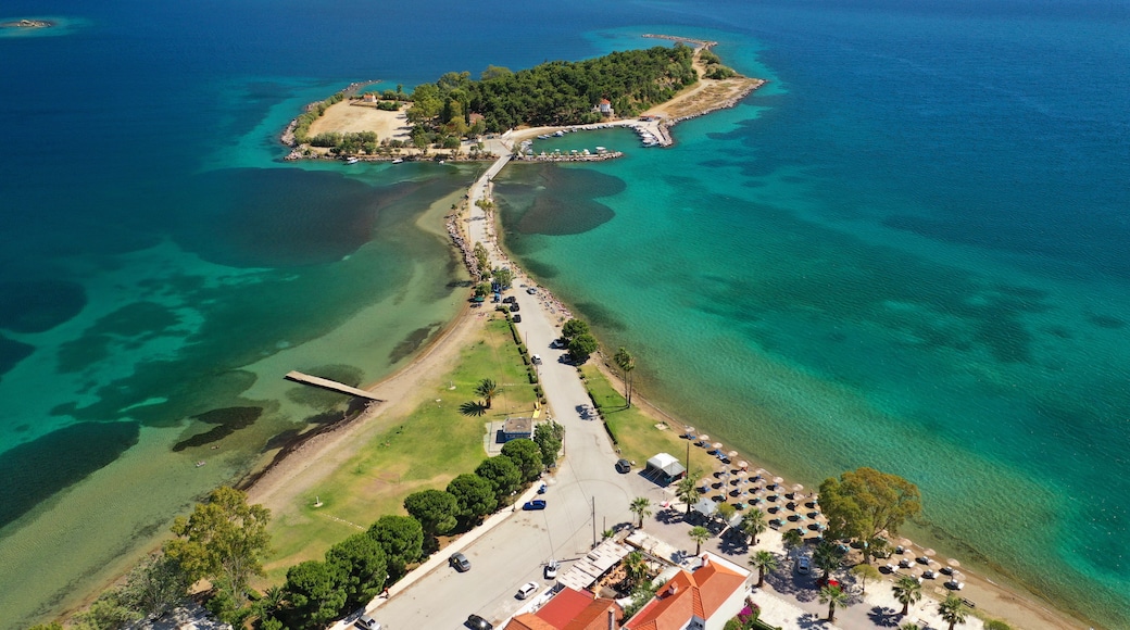 Aerial drone photo of famous island of dreams or Pesonisi connecting with small road with seaside fishing village of Eretria, Central Evia island, Greece