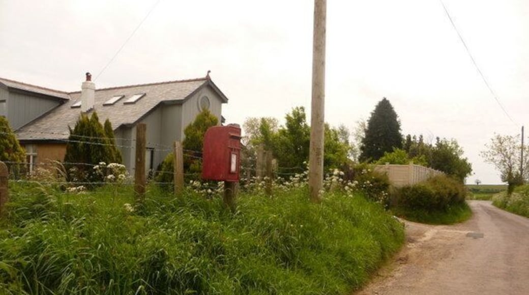Doulting: postbox № BA3 143, Farringdon Lane A small postbox just north of the main road, whose junction we see in the distance. It is emptied at 11am on weekdays and at 9am on Saturdays.