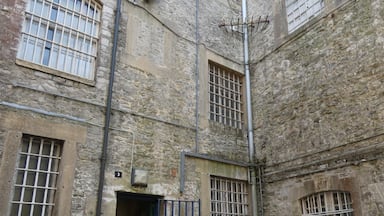 HMP Shepton Mallet, sometimes known as Cornhill, is a former prison located in Shepton Mallet, Somerset, England. When it closed in 2013, it was the United Kingdom's oldest operating prison, and had been since the closure of HMP Lancaster Castle in 2011. Before closure Shepton Mallet was a category C lifer prison holding 189 prisoners. The prison building is grade II* listed, while the former gatehouse and perimeter walls are grade II. It is also reported to be the most haunted prison in England. Take a tour around this amazing establishment steeped in history, guided by a former prison officer - certainly worth a visit.