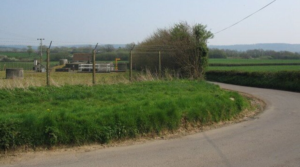 Bend on Strap Lane A view looking to the east from the sharp bend on Strap Lane, towards Upton Noble sewage treatment works.