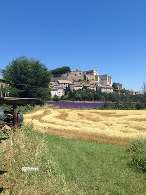 Green field, tractor, mown wheat, lavender and a hilltop town. How gorgeous is Cote de Rhone, Provence? #colorful