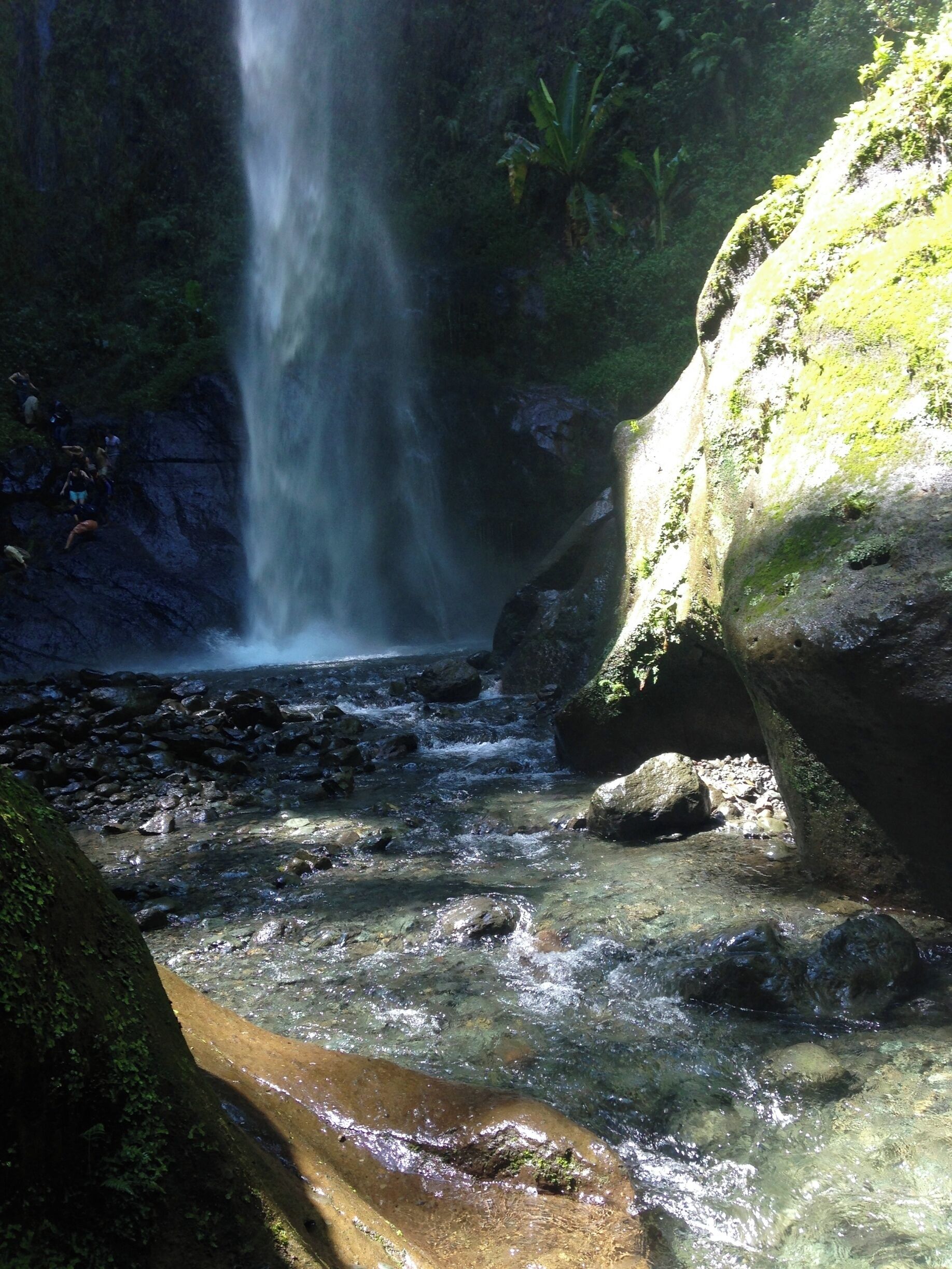 If your up for a muddy three hour hike up a mountain you will be rewarded with an isolated cove hiding a spectacular waterfall. 