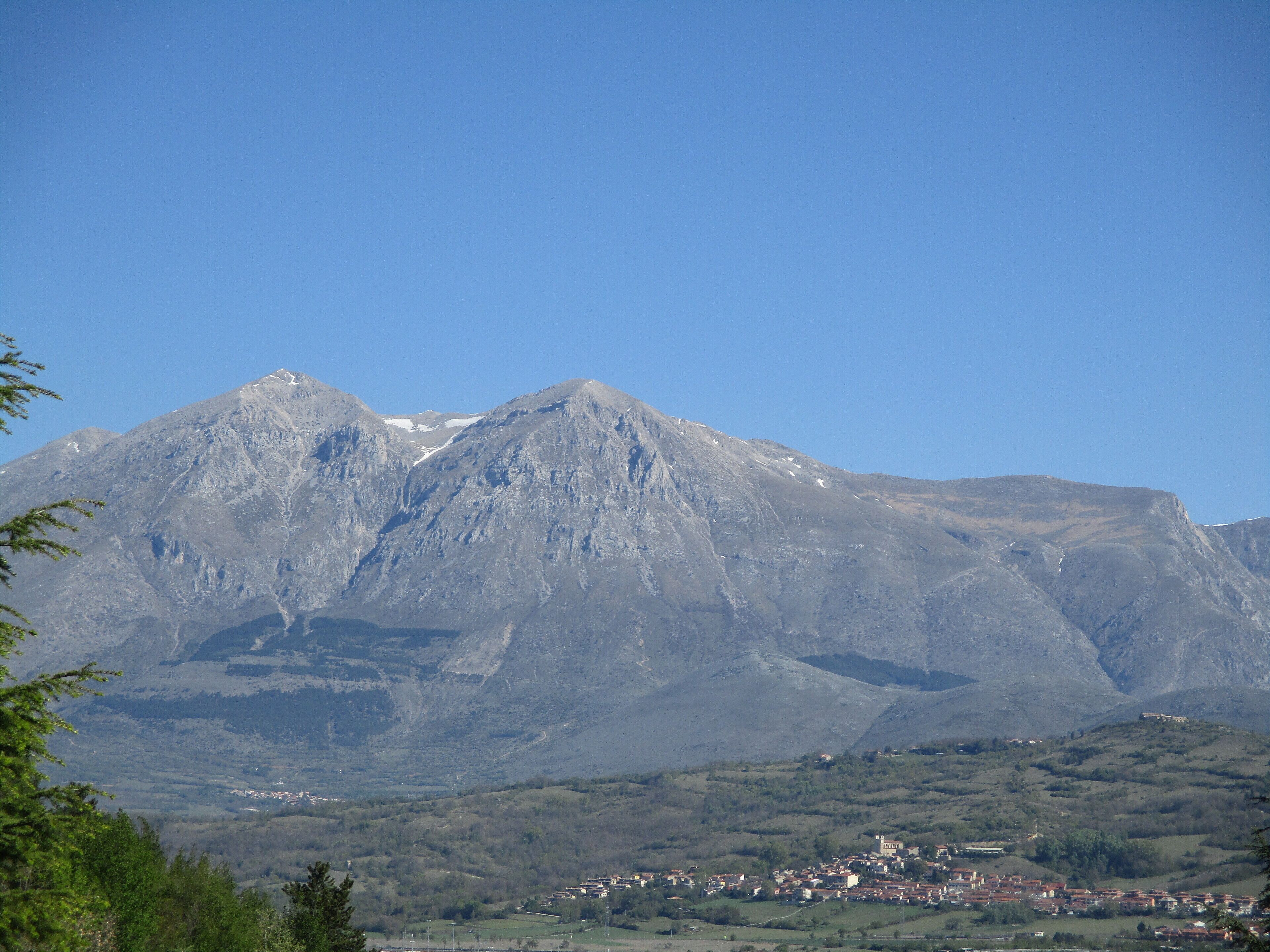 A mountain range with a town at its base.