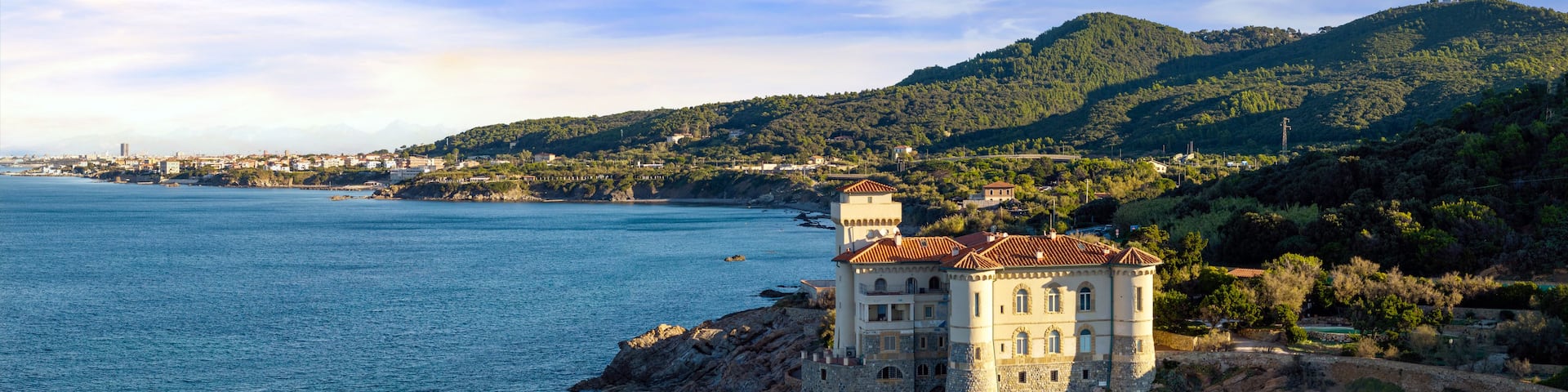 Panoramic Aerial View of Castello del Boccale at Sunrise: Medieval Castle on the Rocky Cliffs of Livorno Coast, Tuscany Italy