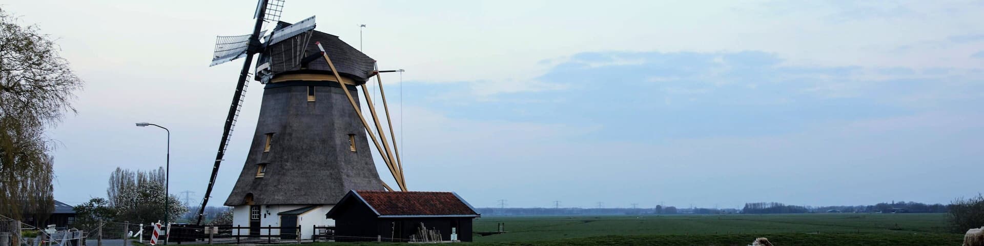 This Windmill in Aboude Netherlands has been converted to a an amazing three bedroom Air B and B rental. We had the pure joy of staying 2 nights in it in April. The countryside around it is beautiful farmland and a small canal runs right across the small road from it. You can walk or bike to Abcode about 1 mile off and more then anything just relax and enjoy staying in such an amazing place.