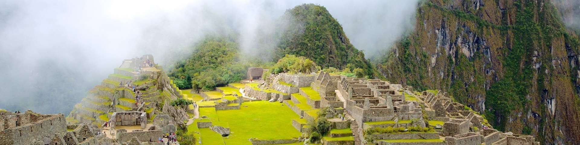 Machu Picchu showing mist or fog and a ruin