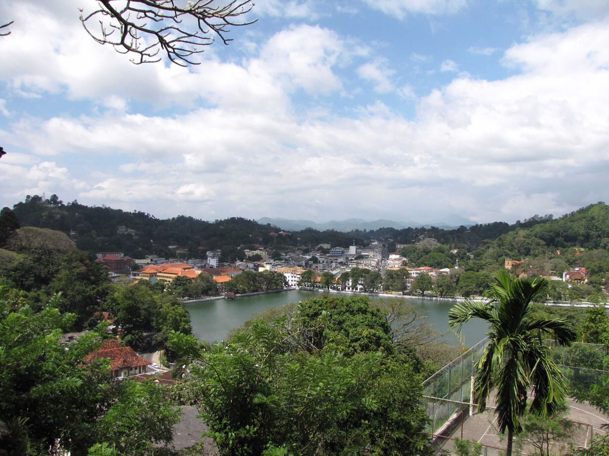 Kandy (Sinhalese: මහ නුවර Maha nuwara, pronounced [mahaˈnuʋərə]; Tamil: கண்டி, pronounced [ˈkaɳɖi]) is a major city in Sri Lanka, located in the Central Province, Sri Lanka. It is the second largest city in the country after Colombo. It was the last capital of the ancient kings' era of Sri Lanka.[1] The city lies in the midst of hills in the Kandy plateau, which crosses an area of tropical plantations, mainly tea. Kandy is both an administrative and religious city and is also the capital of the Central Province. Kandy is the home of The Temple of the Tooth Relic (Sri Dalada Maligawa), one of the most sacred places of worship in the Buddhist world. It was declared a world heritage site by UNESCO in 1988.

#JitTravelDiaries #Kandy #SriLanka