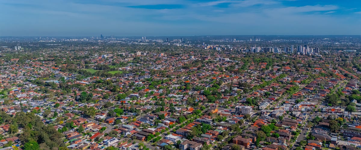 Panorama aerial drone view of western Sydney Suburbs of Canterbury Burwood Ashfield Marrickville Campsie with Houses roads and parks in Sydney New South Wales NSW Australia
