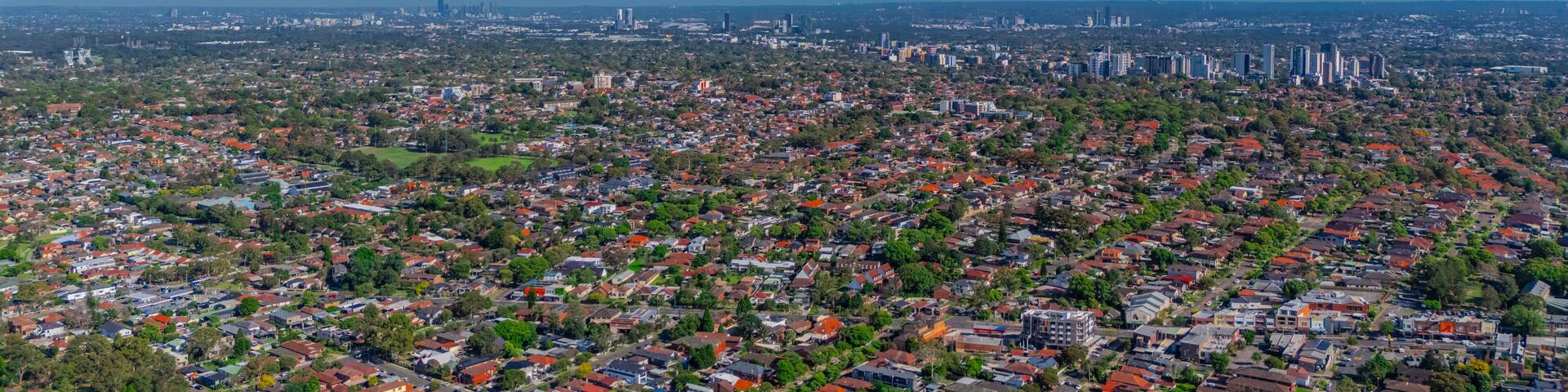 Panorama aerial drone view of western Sydney Suburbs of Canterbury Burwood Ashfield Marrickville Campsie with Houses roads and parks in Sydney New South Wales NSW Australia