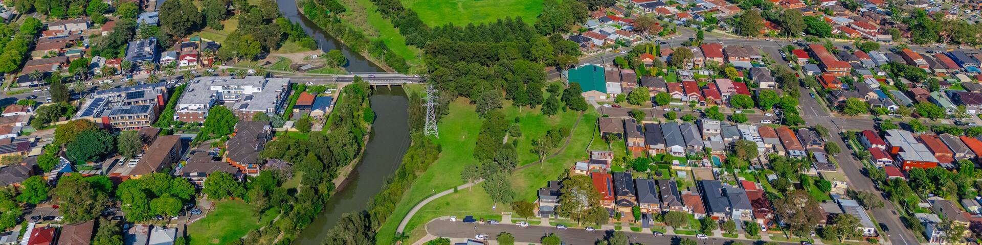 Panorama aerial drone view of western Sydney Suburbs of Canterbury Burwood Ashfield Marrickville Campsie with Houses roads and parks in Sydney New South Wales NSW Australia