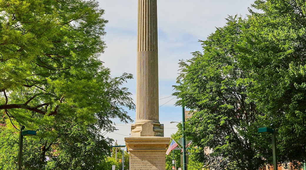 Vertical of soldier statue atop tall Greek pillar in Public Square park in downtown Mount Vernon