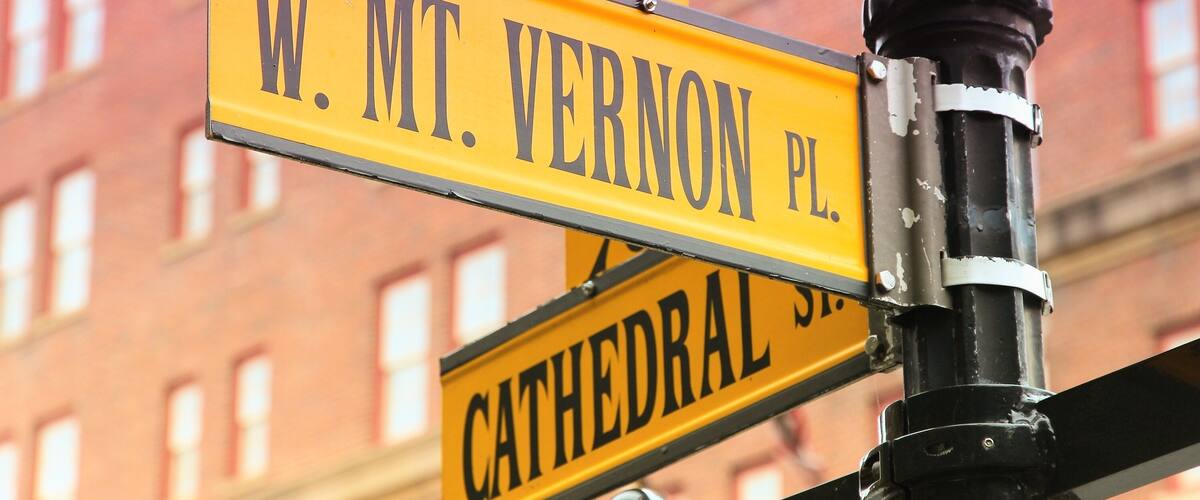 Street signs for W. Mt. Vernon Pl. and Cathedral St.