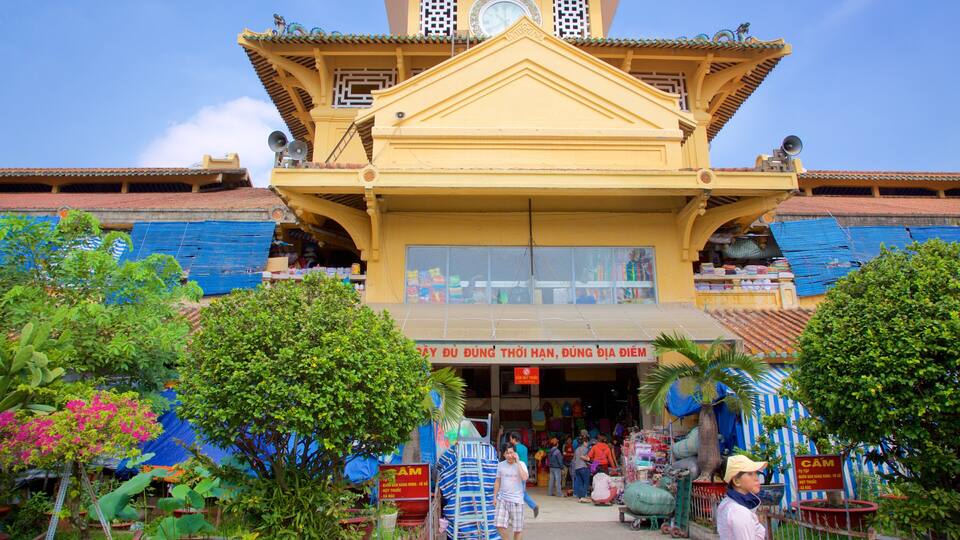 A traditional yellow building with a sign in Vietnamese.
