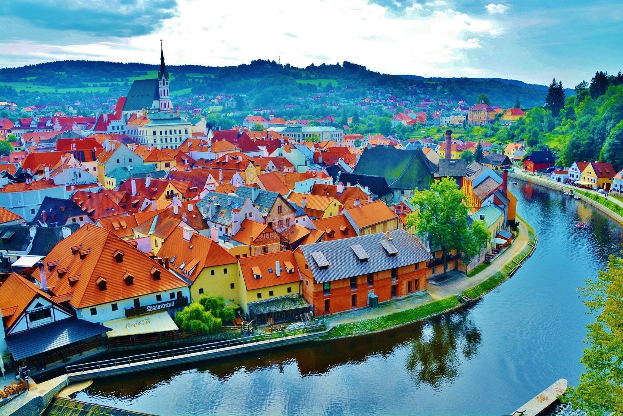 Cesky Krumlov city from the castle - wrapped around by the Vlatava river - which acted as a moat and protected the city during wars. A colorful beautiful city which definitely was the highlight of my trip! This is a UNESCO world heritage site! No cars are allowed in the old city ... love love love this place! It was mid way from Salzburg to Prague on our road trip!  #stunningstructures #ceskykrumlov #czechrepublic 