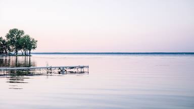 A purple sunset on the shoreline of Oneida Lake.