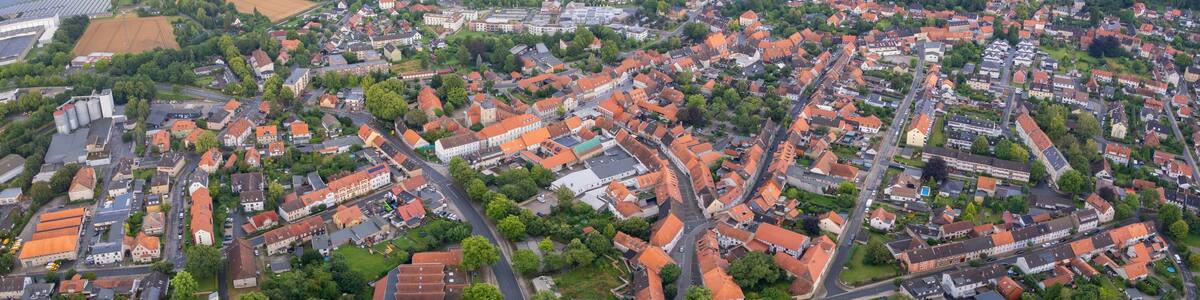 Aerial view around the old town in the city Königslutter am Elm, on an cloudy spring noon