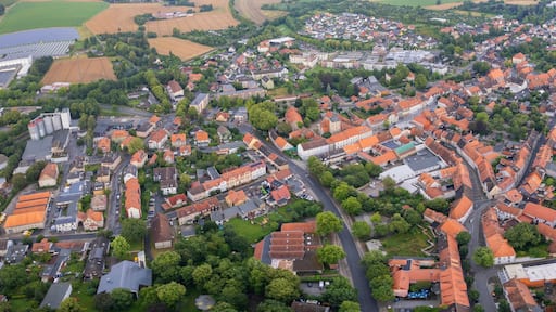 Aerial view around the old town in the city Königslutter am Elm, on an cloudy spring noon