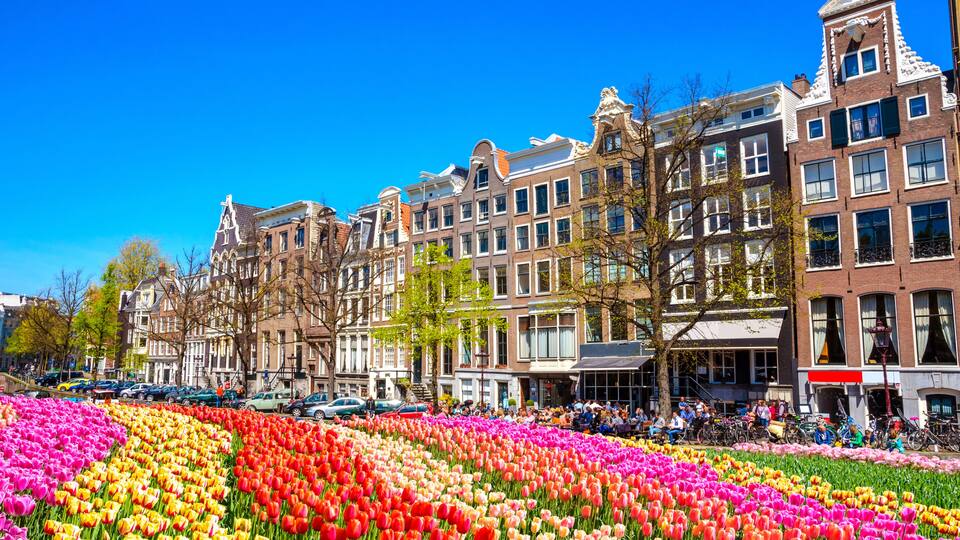 Traditional old buildings and and boats in Amsterdam, Netherlands. Canals of Amsterdam, Shutterstock ID 556537813, Purchase Order: -