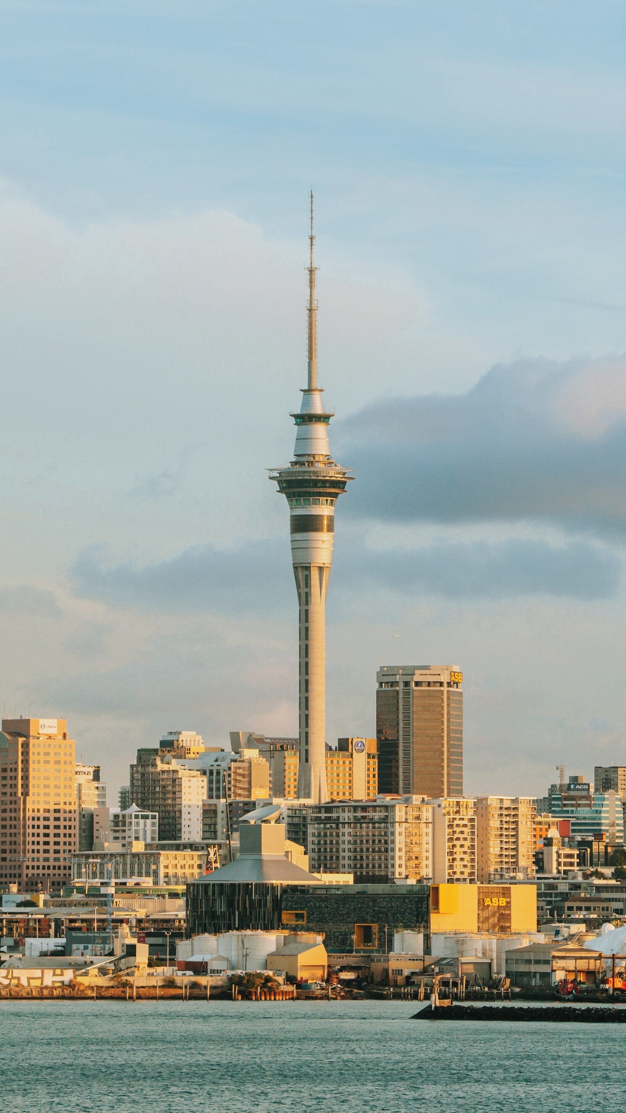 Sky Tower rises majestically above Auckland Central Business District in Auckland Region showcasing urban skyline beauty