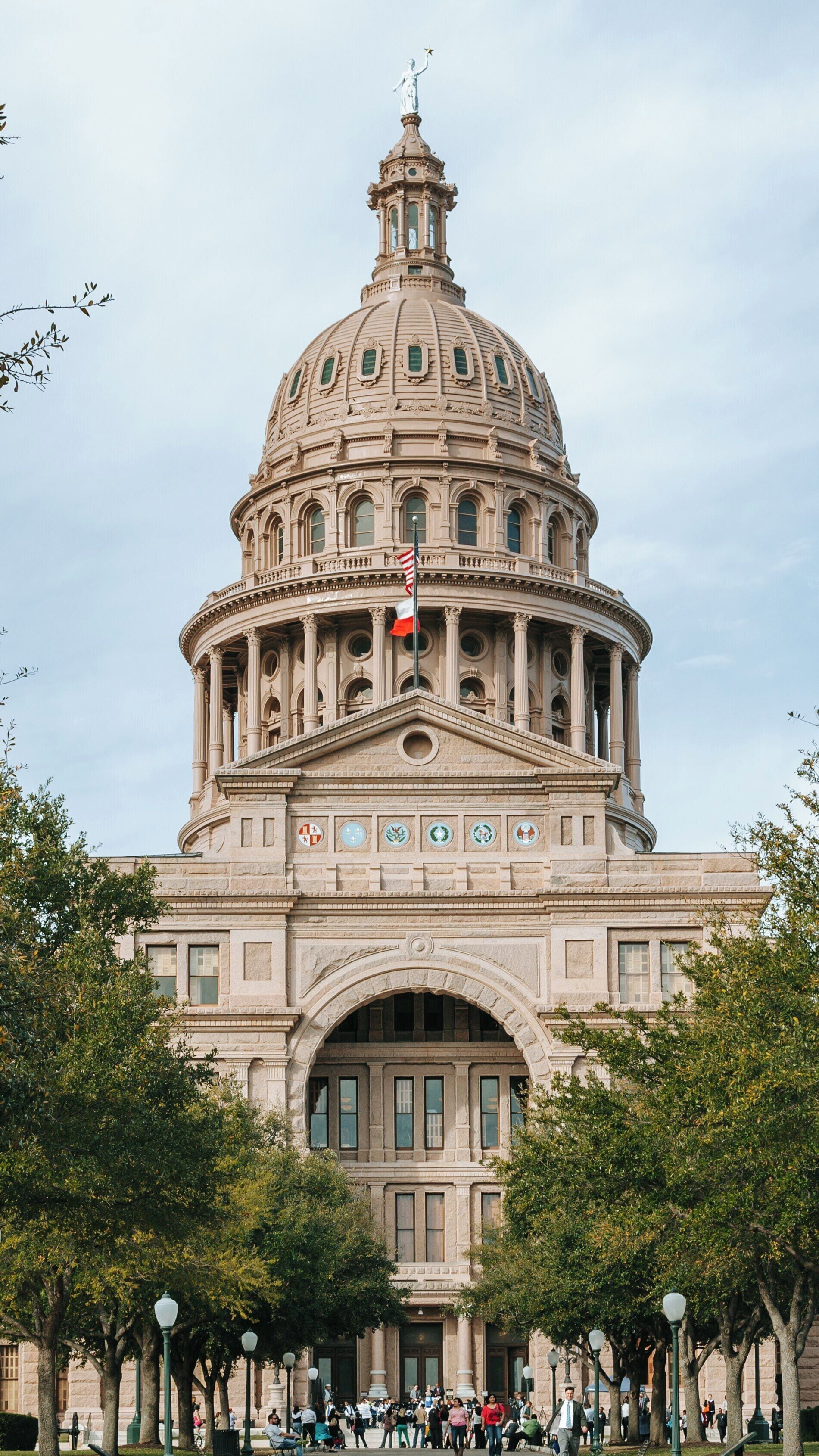Texas State Capitol stands proudly in downtown Austin showcasing impressive architecture and vibrant surroundings on a cloudy day