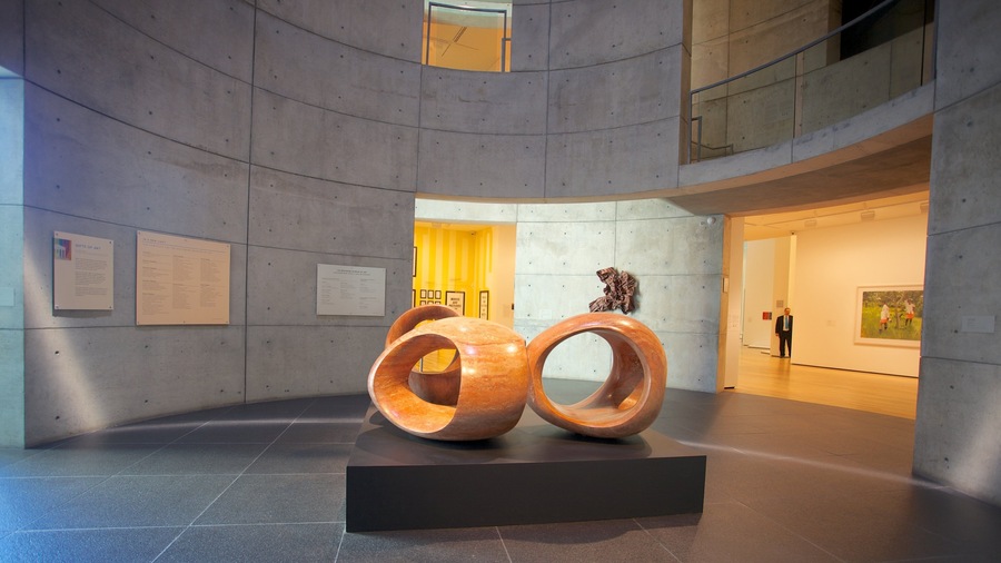 Contemporary art installation featuring wooden sculptures in Baltimore's cultural center with nearby exhibits