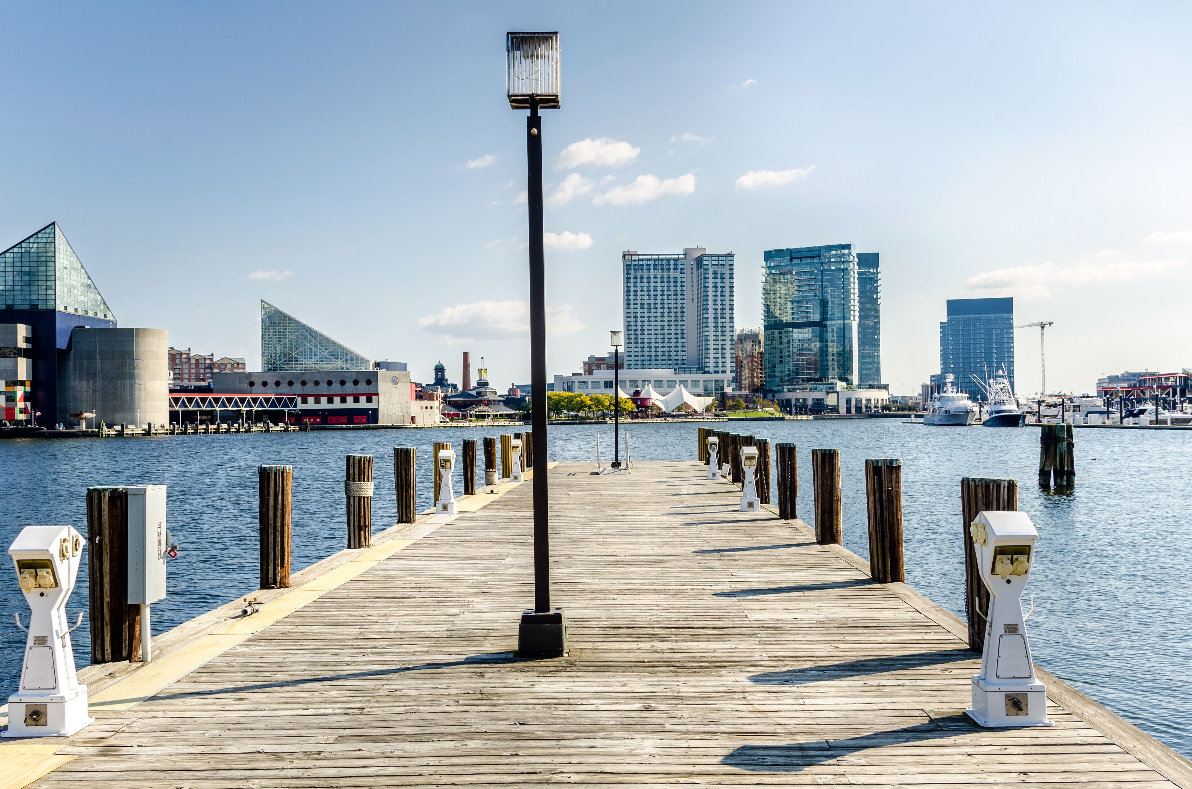 Deserted Wooden Jetty with Electric Sockets and Mooring Pole at Baltimore Harbour on a Sunny Autumn Day