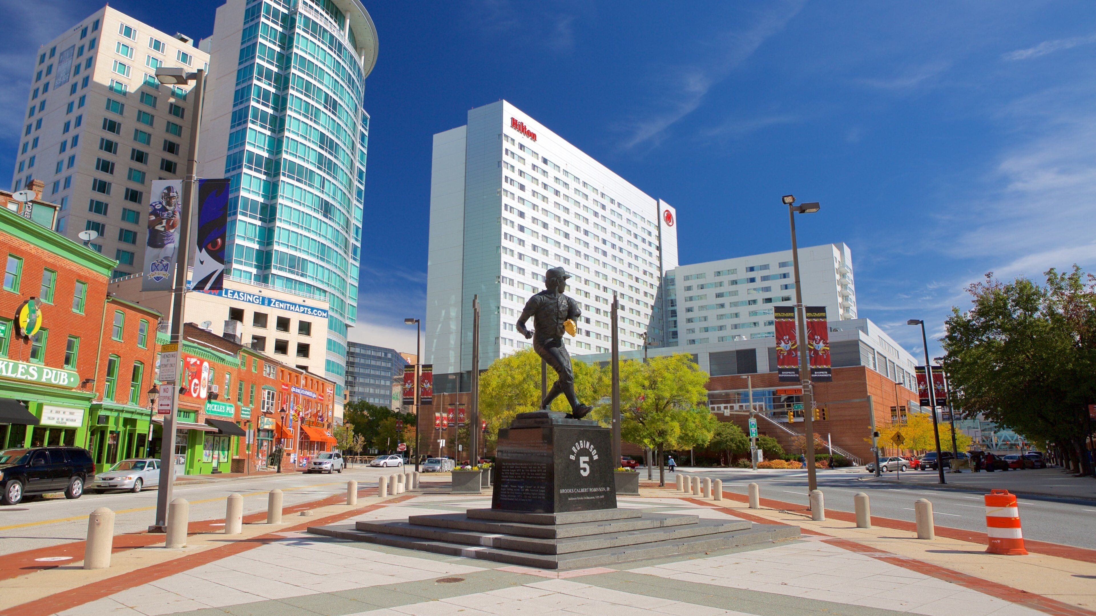 Baltimore which includes a square or plaza, a city and a statue or sculpture