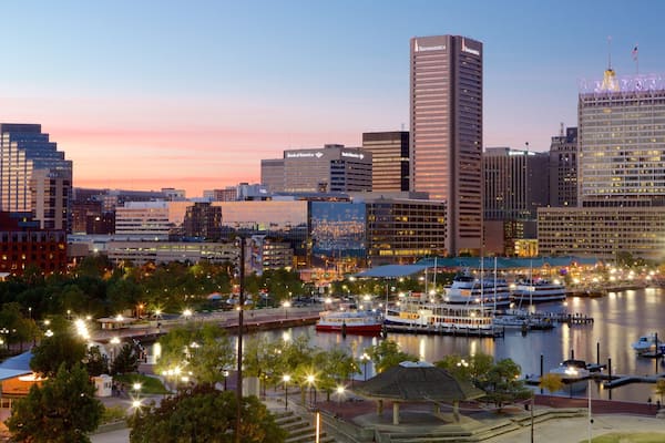 Baltimore featuring a sunset, skyline and a marina