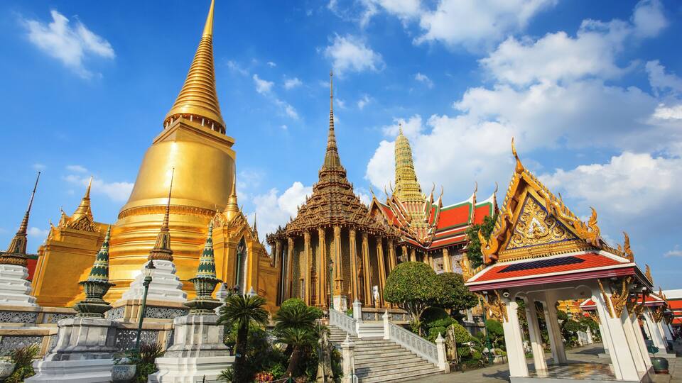 A temple complex with golden spires and intricate architecture.
