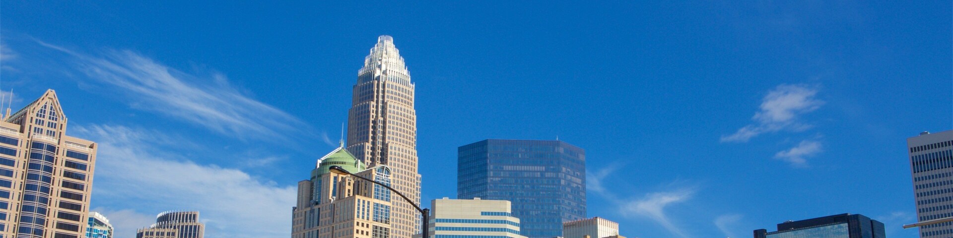 Charlotte showing a high-rise building and a city