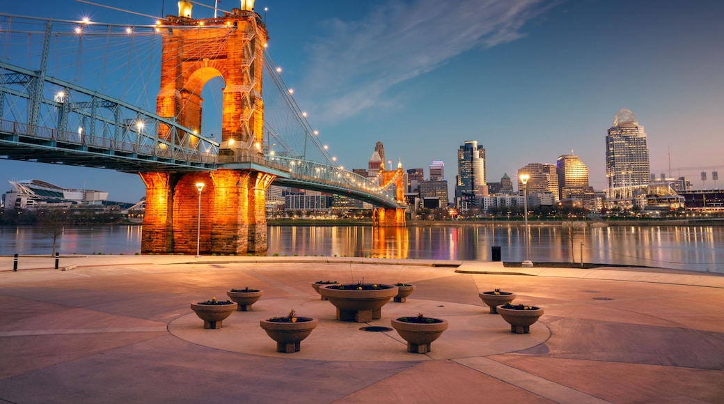 Cincinnati, Ohio, USA. Cityscape image of Cincinnati, Ohio, USA downtown skyline with the John A. Roebling Suspension Bridge and reflection of the city in the Ohio River at spring sunrise.