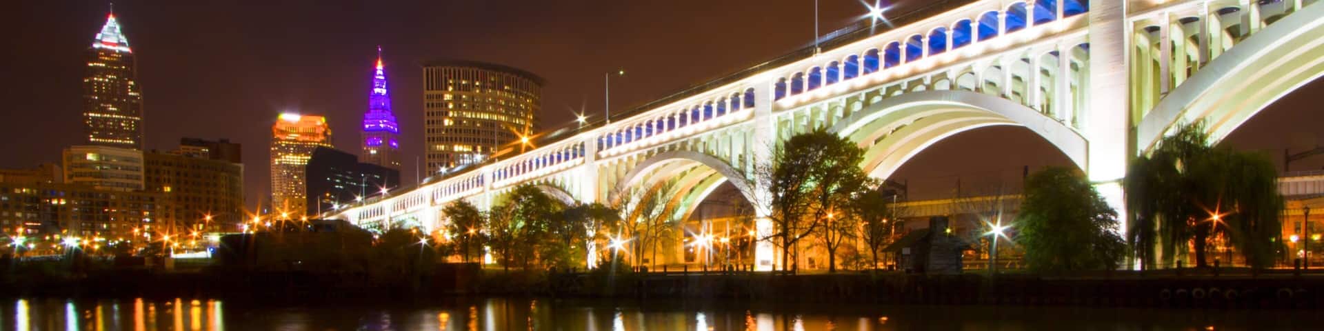 Cleveland showing a city, a bridge and night scenes