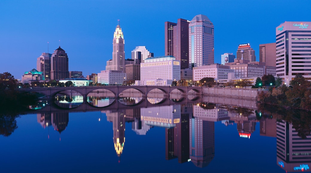 Scioto River and Columbus Ohio skyline, the capital city, at dusk with lights on