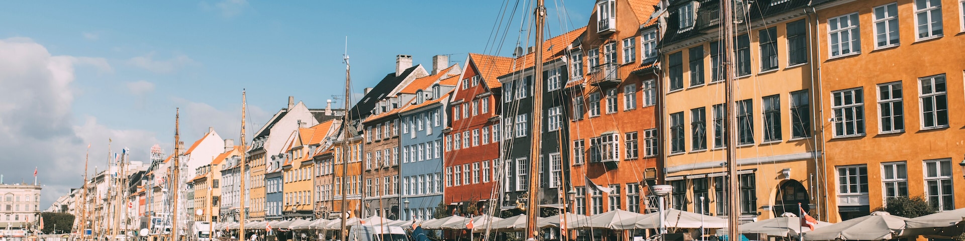 A harbor with colorful buildings and boats docked along the waterfront.