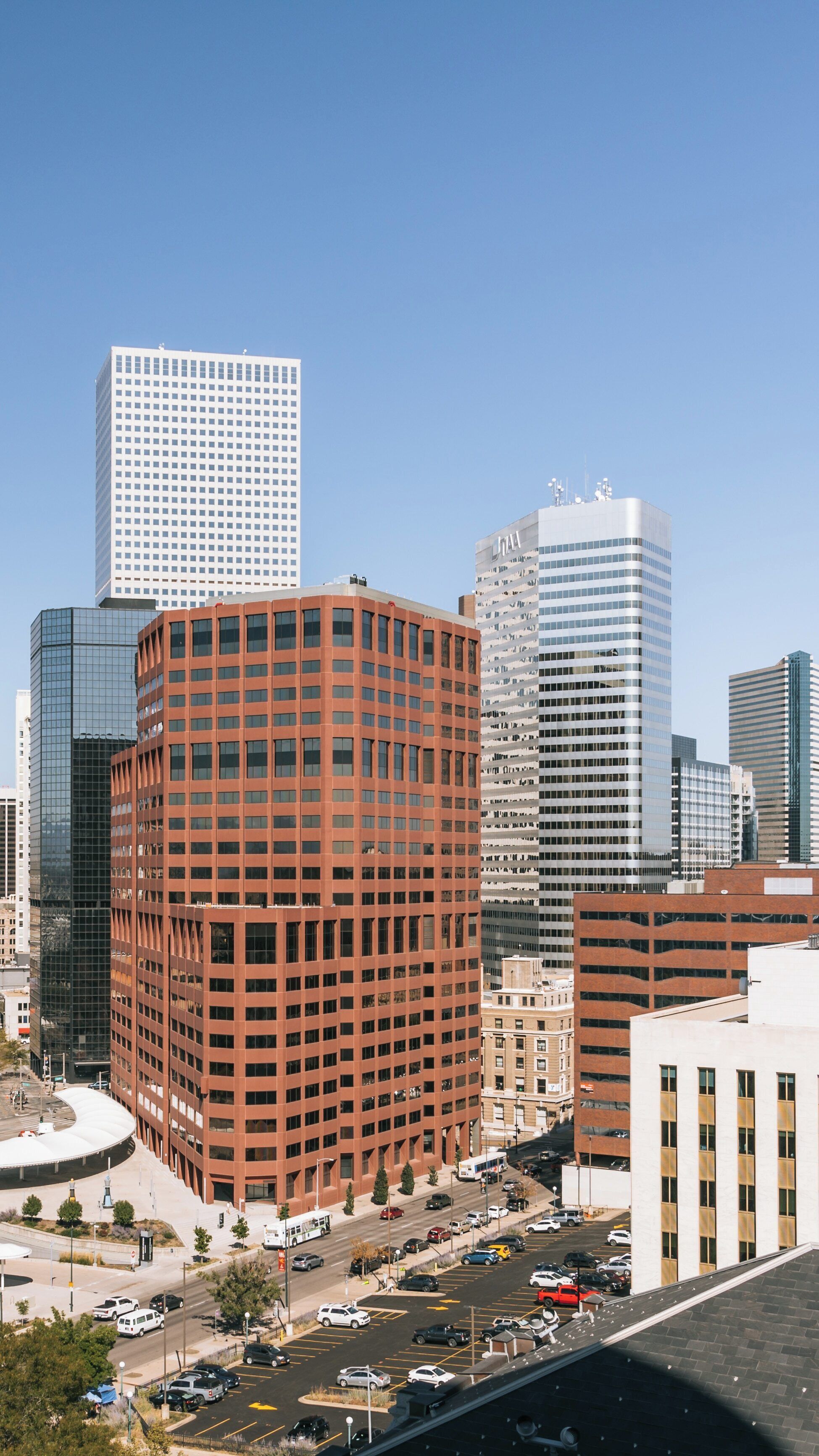 View of the Colorado State Capitol Building surrounded by Denver's modern skyline in Capitol Hill neighborhood