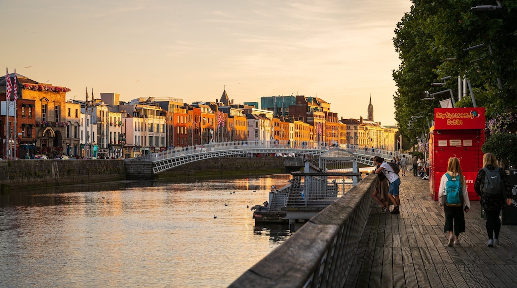 Dublin featuring a river or creek, a sunset and a bridge
