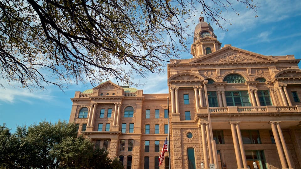 A historic building with ornate architecture, including columns and a clock tower.