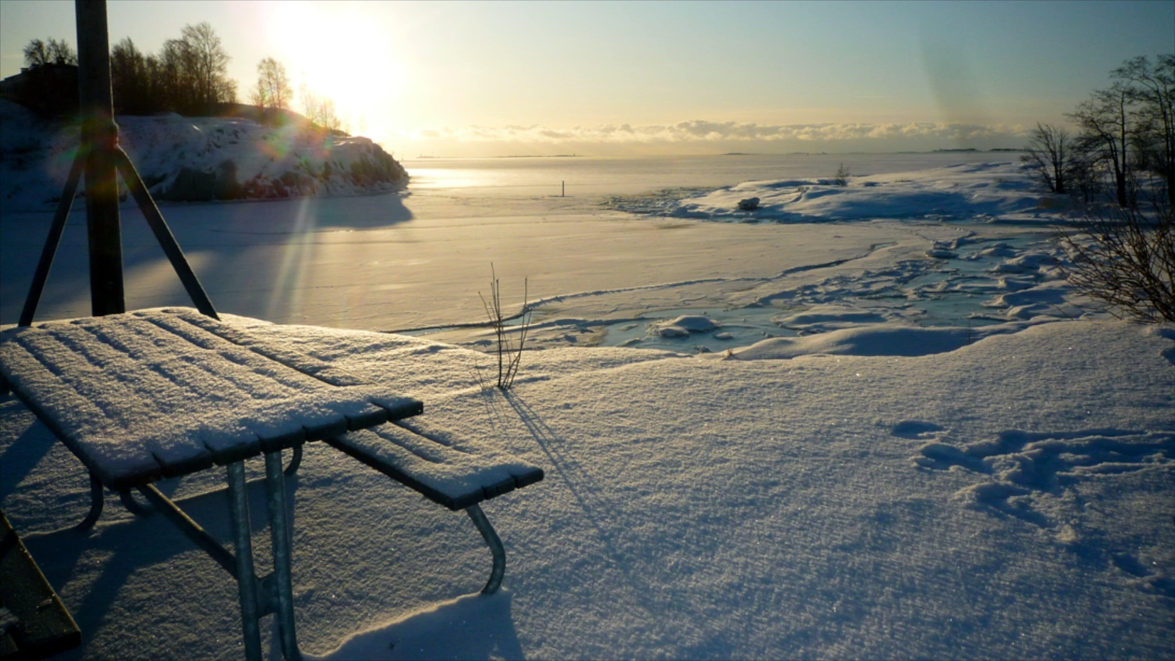 Helsinki showing a sunset and snow