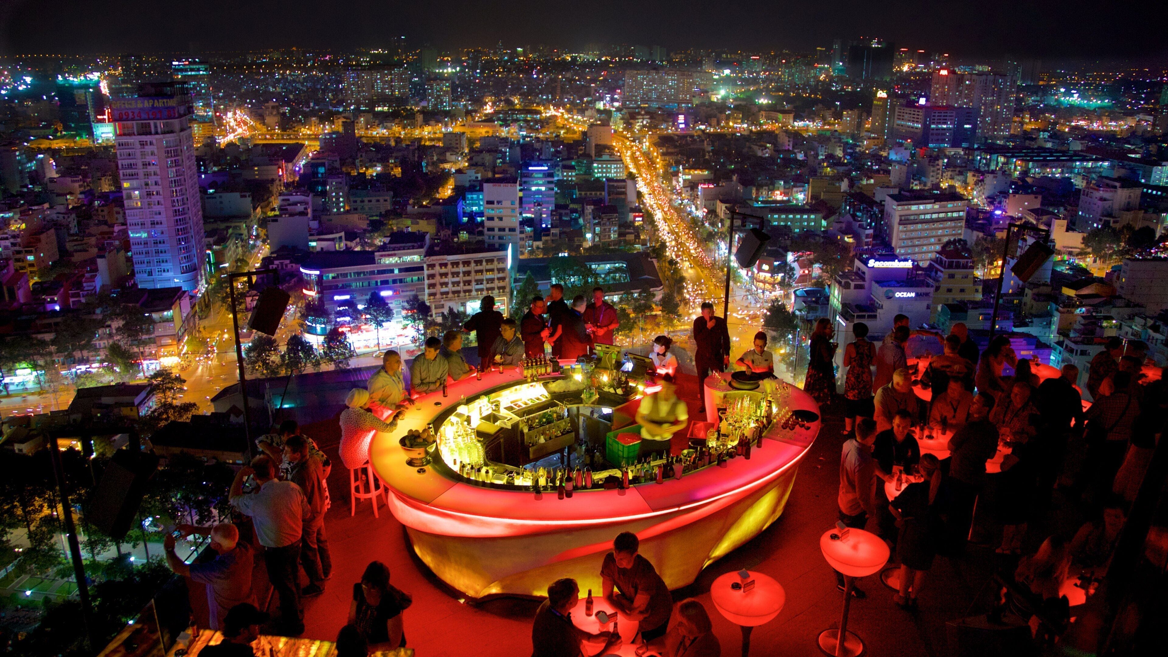 Ho Chi Minh City showing night scenes, a bar and a city