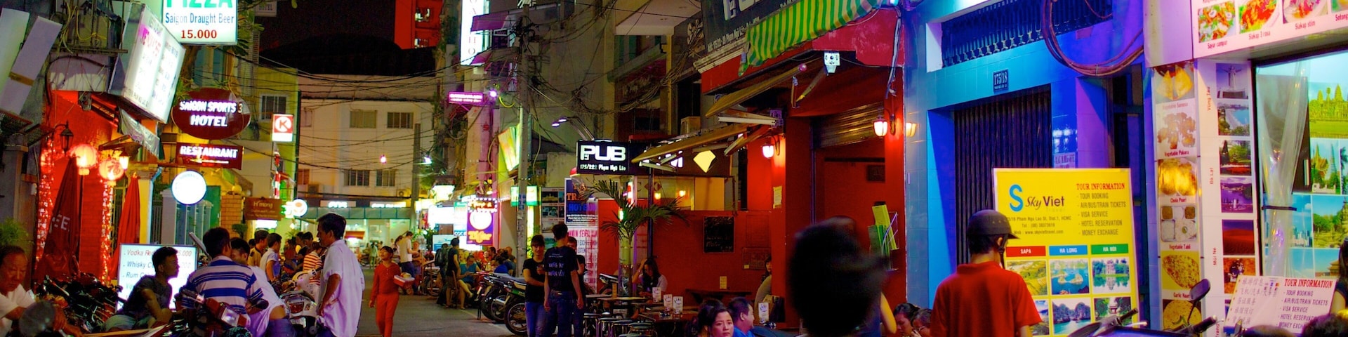 Ho Chi Minh City showing markets, signage and night scenes