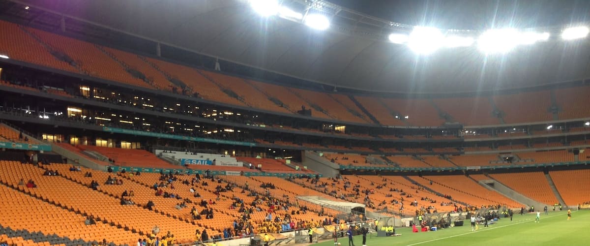 Inside the FNB stadium (known as Soccer City during the 2010 World Cup) at a league match for Kaizer Chiefs, the local team. Tickets are very cheap and, as you can see, they don't usually run out of space. Worth going to see the grandeur of a World Cup Final stadium, but don't have high expectations for the standard of football.