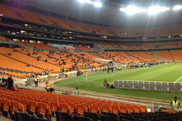 Inside the FNB stadium (known as Soccer City during the 2010 World Cup) at a league match for Kaizer Chiefs, the local team. Tickets are very cheap and, as you can see, they don't usually run out of space. Worth going to see the grandeur of a World Cup Final stadium, but don't have high expectations for the standard of football.