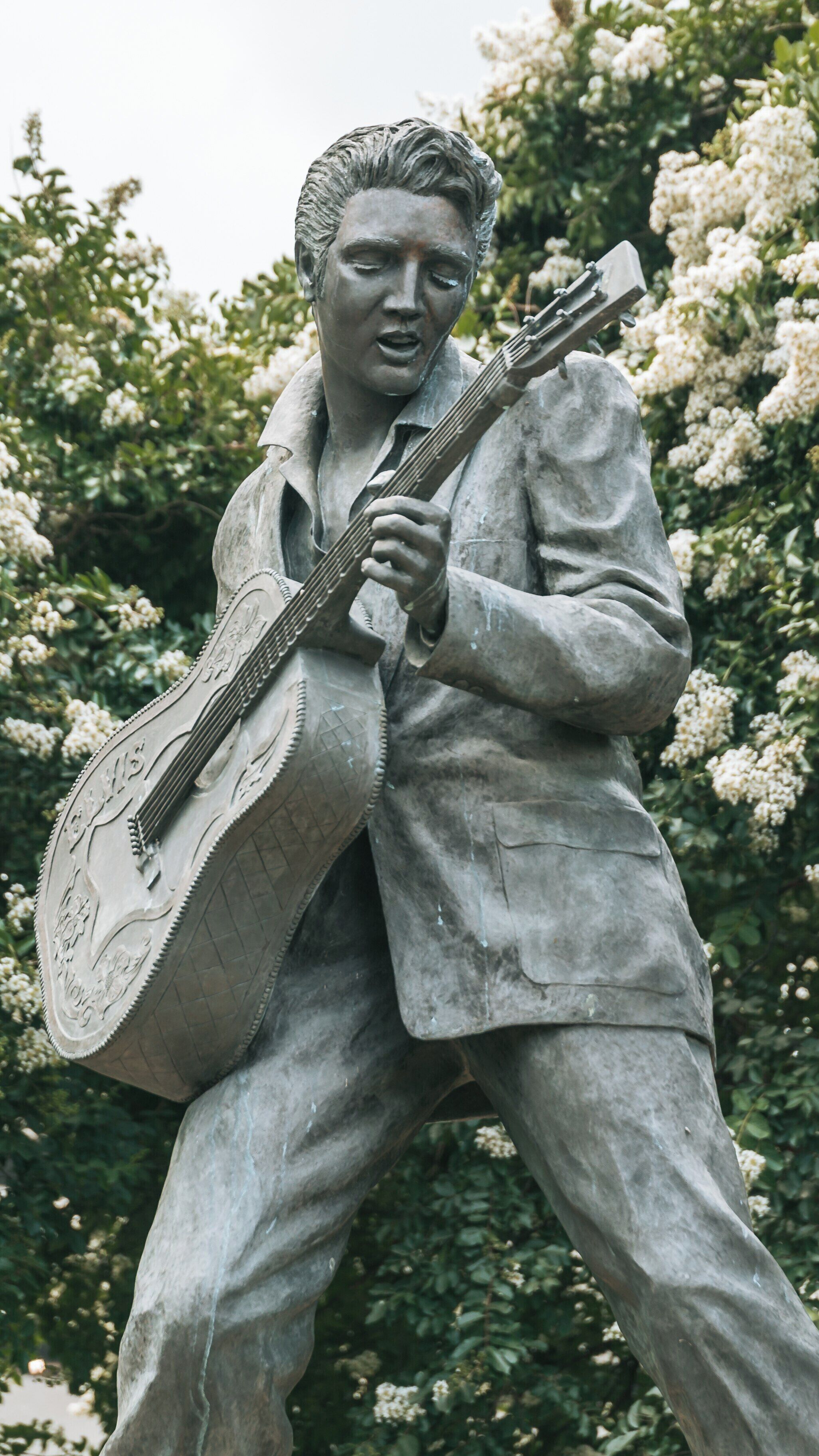 Sculpture of Elvis Presley on Beale Street in Downtown Memphis showcasing vibrant culture and music history of Tennessee