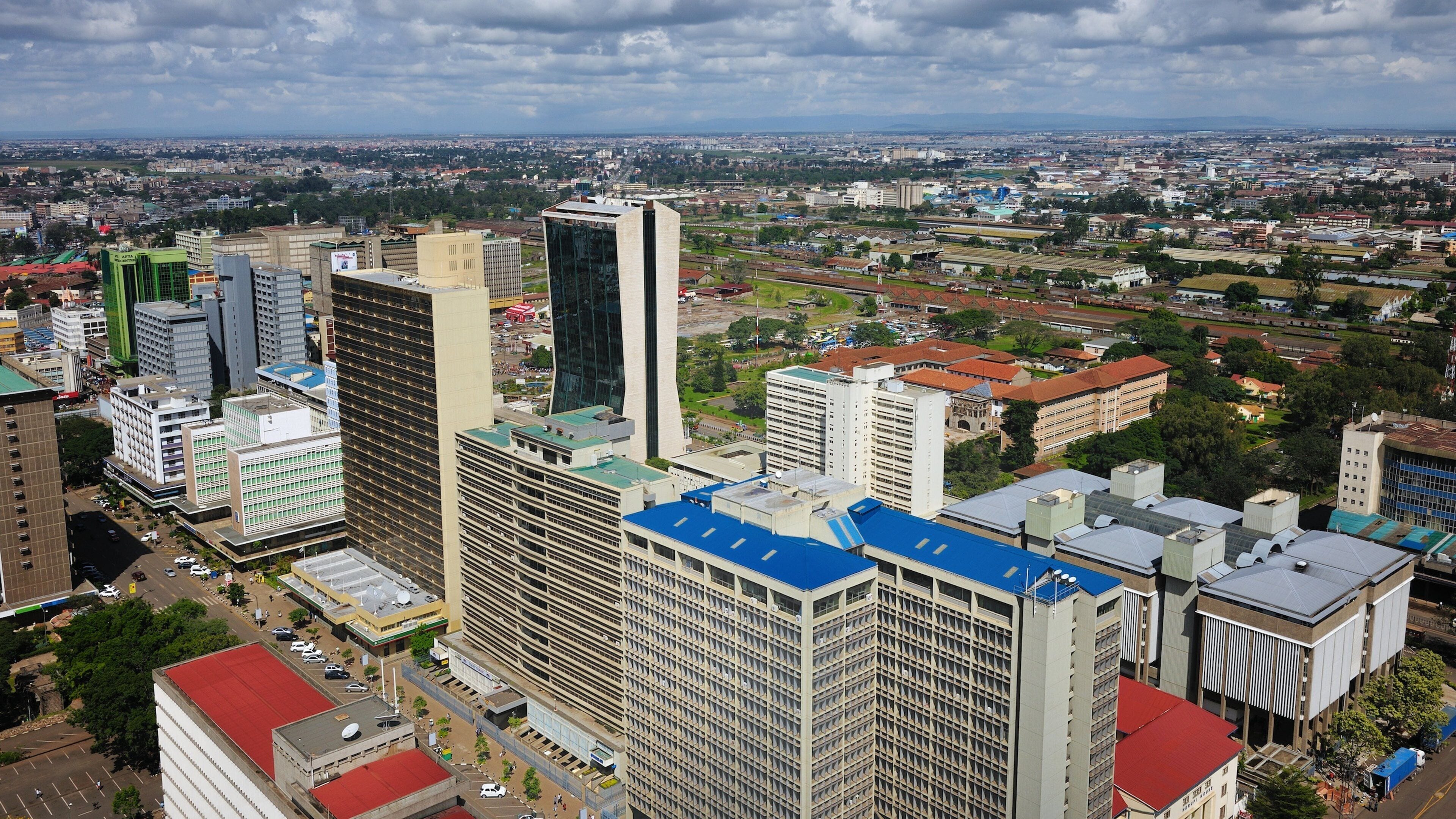 Urban skyline of Nairobi showcasing the vibrant city landscape and surrounding areas under a cloudy sky