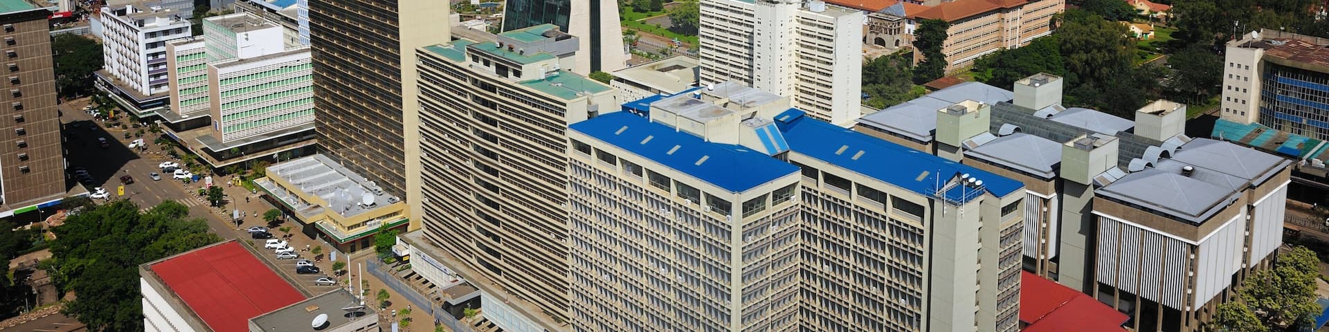 Urban skyline of Nairobi showcasing the vibrant city landscape and surrounding areas under a cloudy sky
