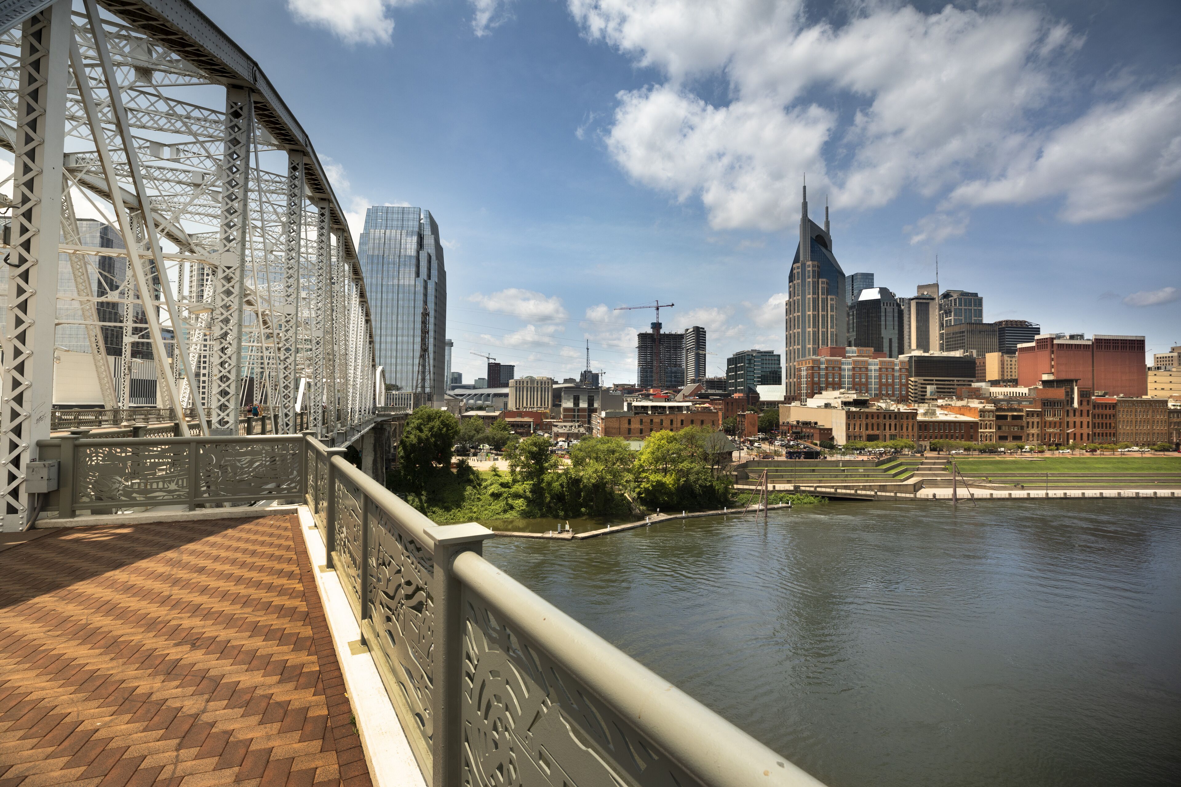 A bridge with a city skyline in the background.